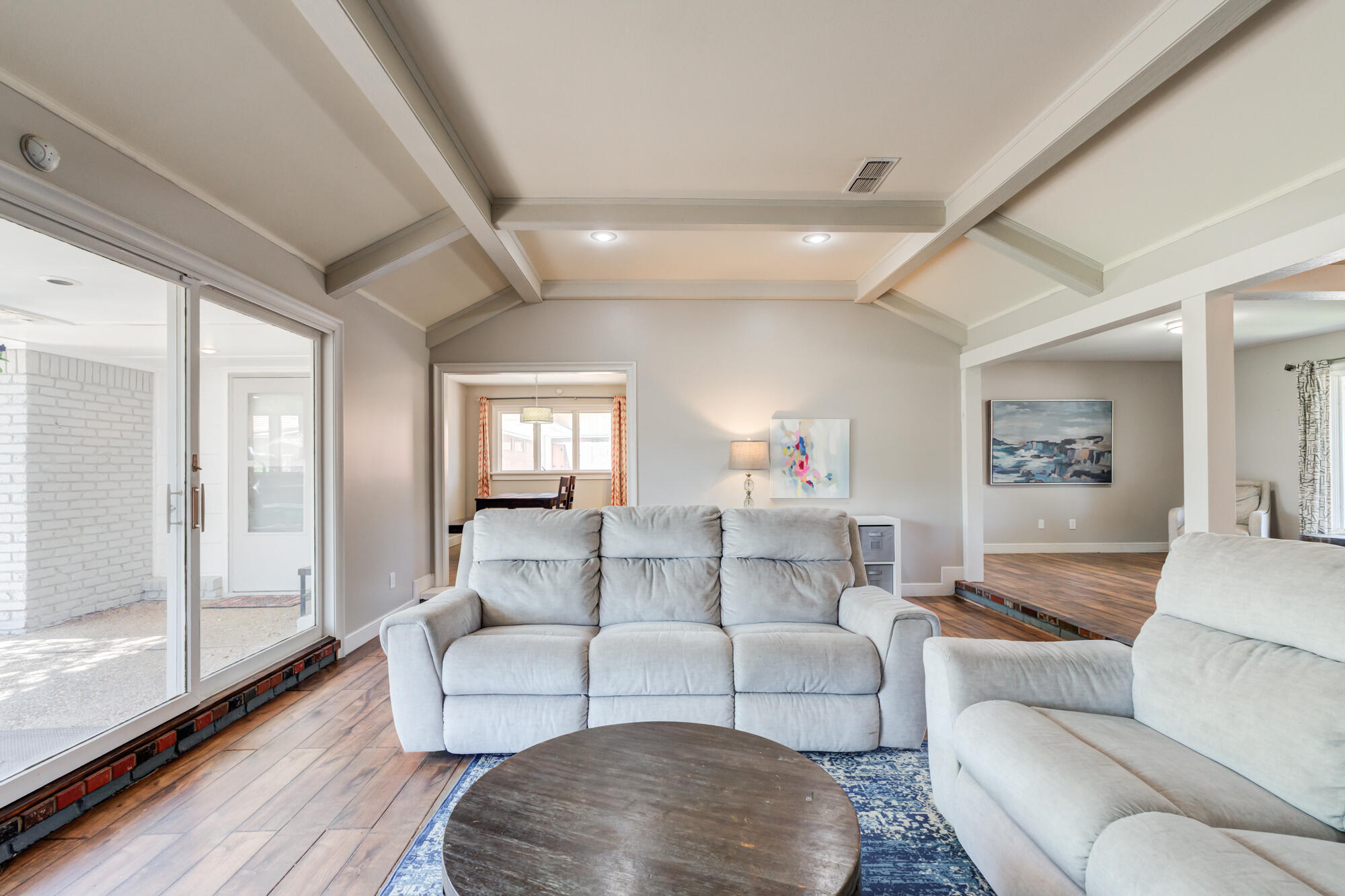 4507 8th Street Lubbock, TX 79416 - Photo 13 of 42 a living room with furniture and a large window