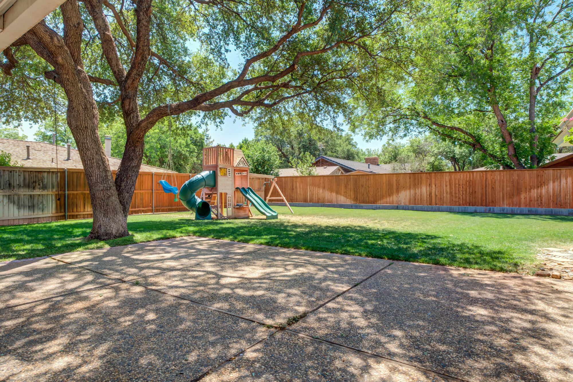 4507 8th Street Lubbock, TX 79416 - Photo 2 of 42 a view of a park with large trees