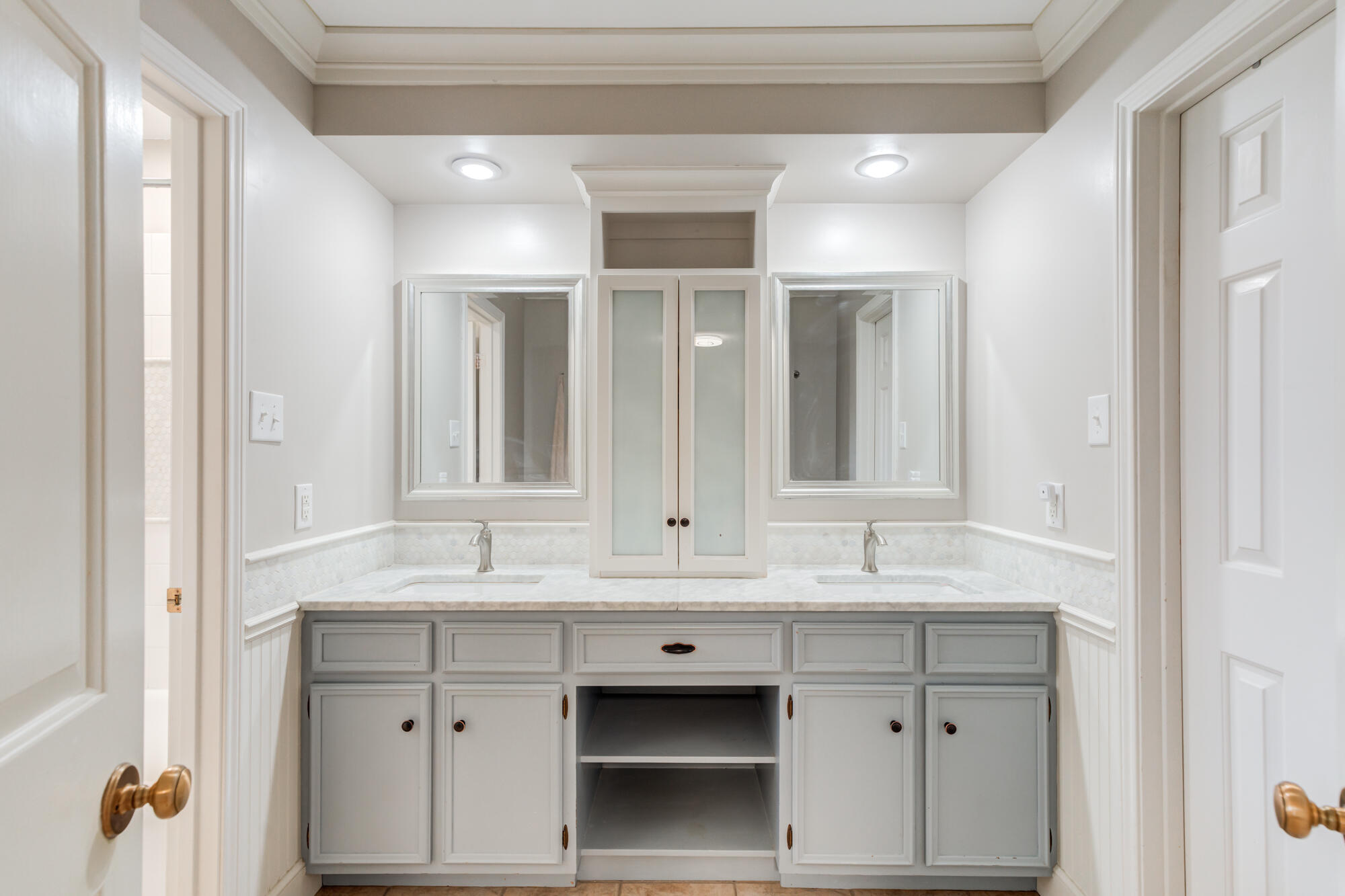 4507 8th Street Lubbock, TX 79416 - Photo 24 of 42 a bathroom with a sink double vanity and a mirror
