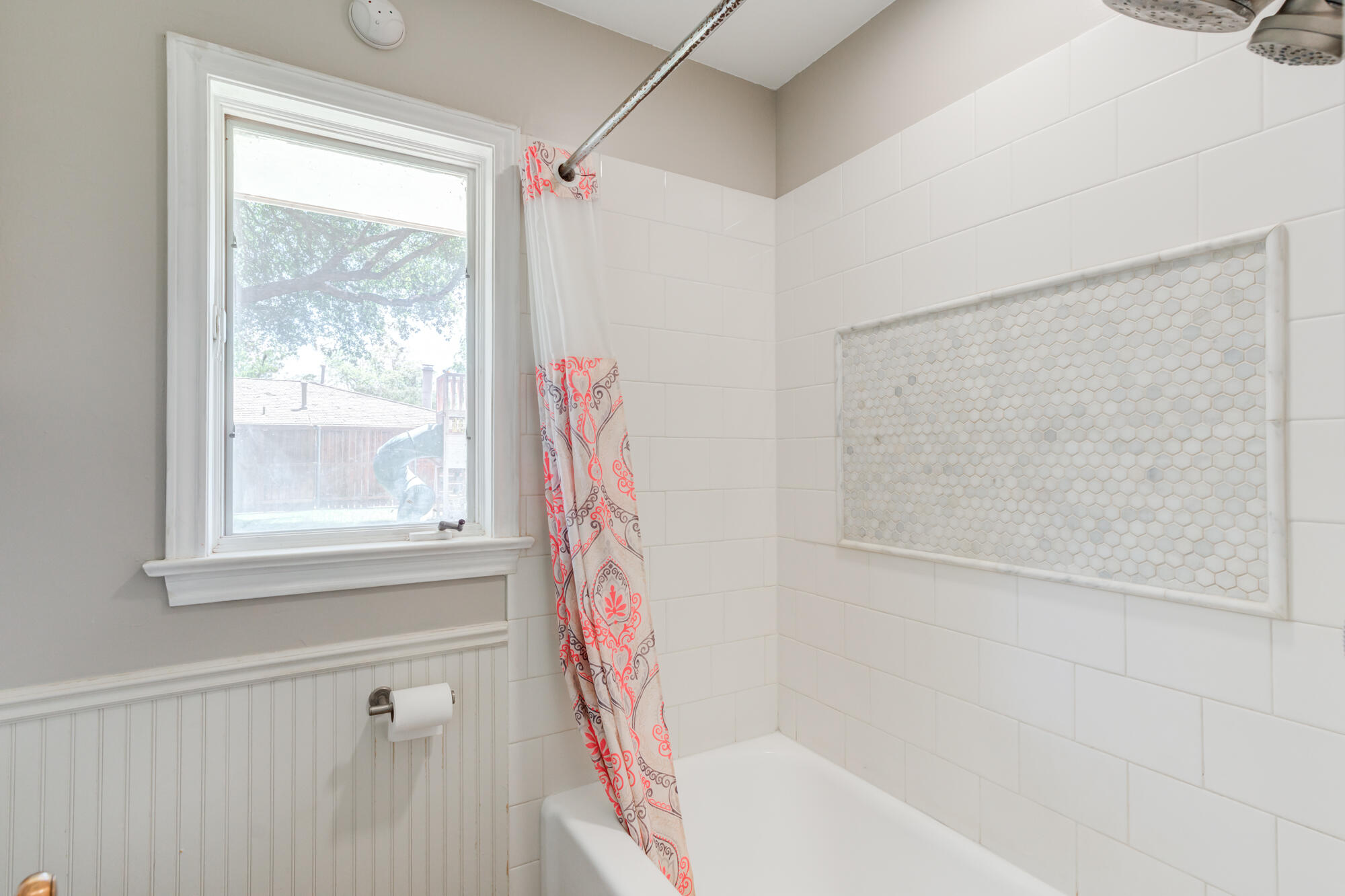 4507 8th Street Lubbock, TX 79416 - Photo 25 of 42 a bathroom with a bathtub and shower