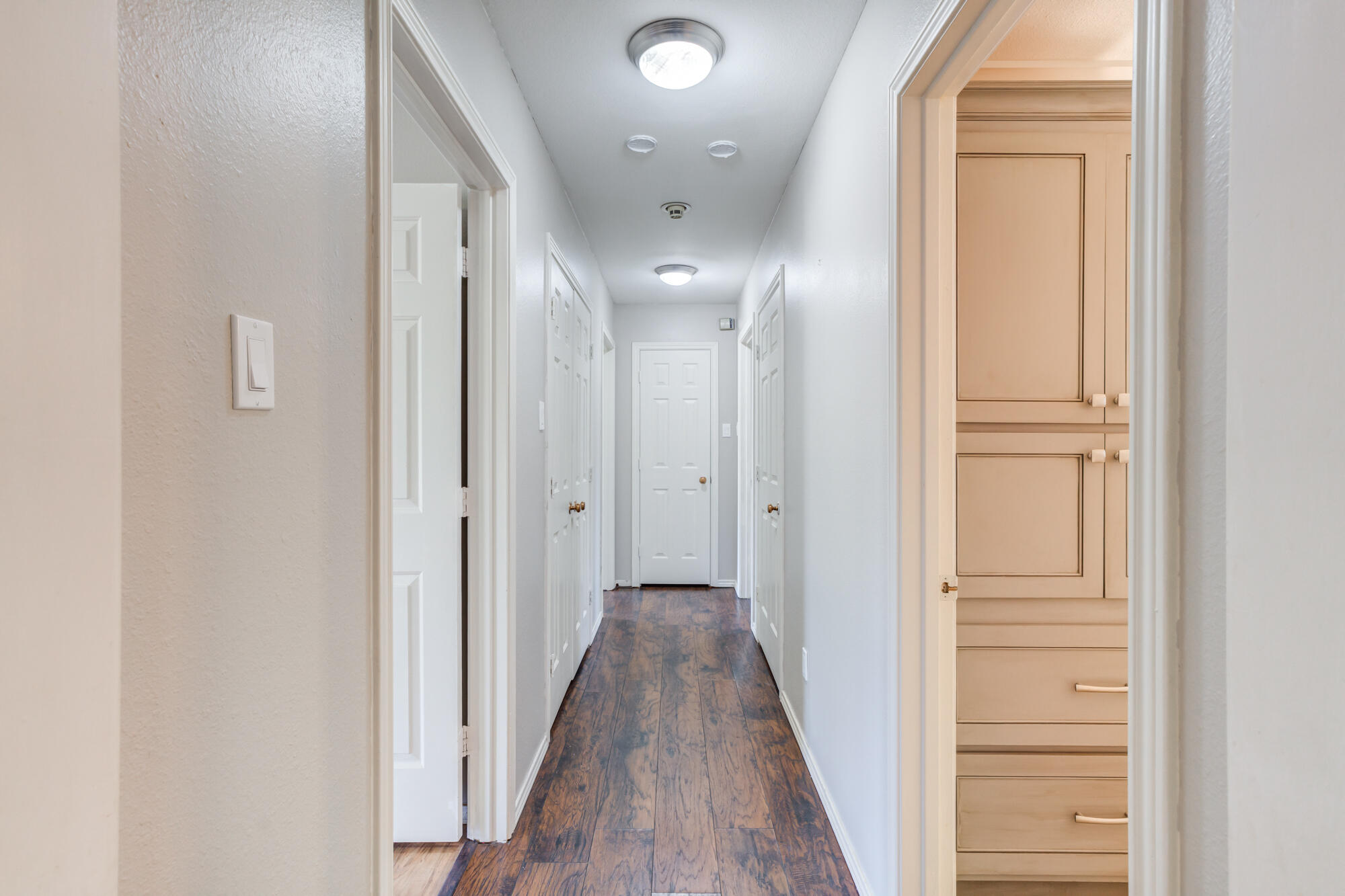 4507 8th Street Lubbock, TX 79416 - Photo 26 of 42 a view of a hallway with wooden floor and entryway
