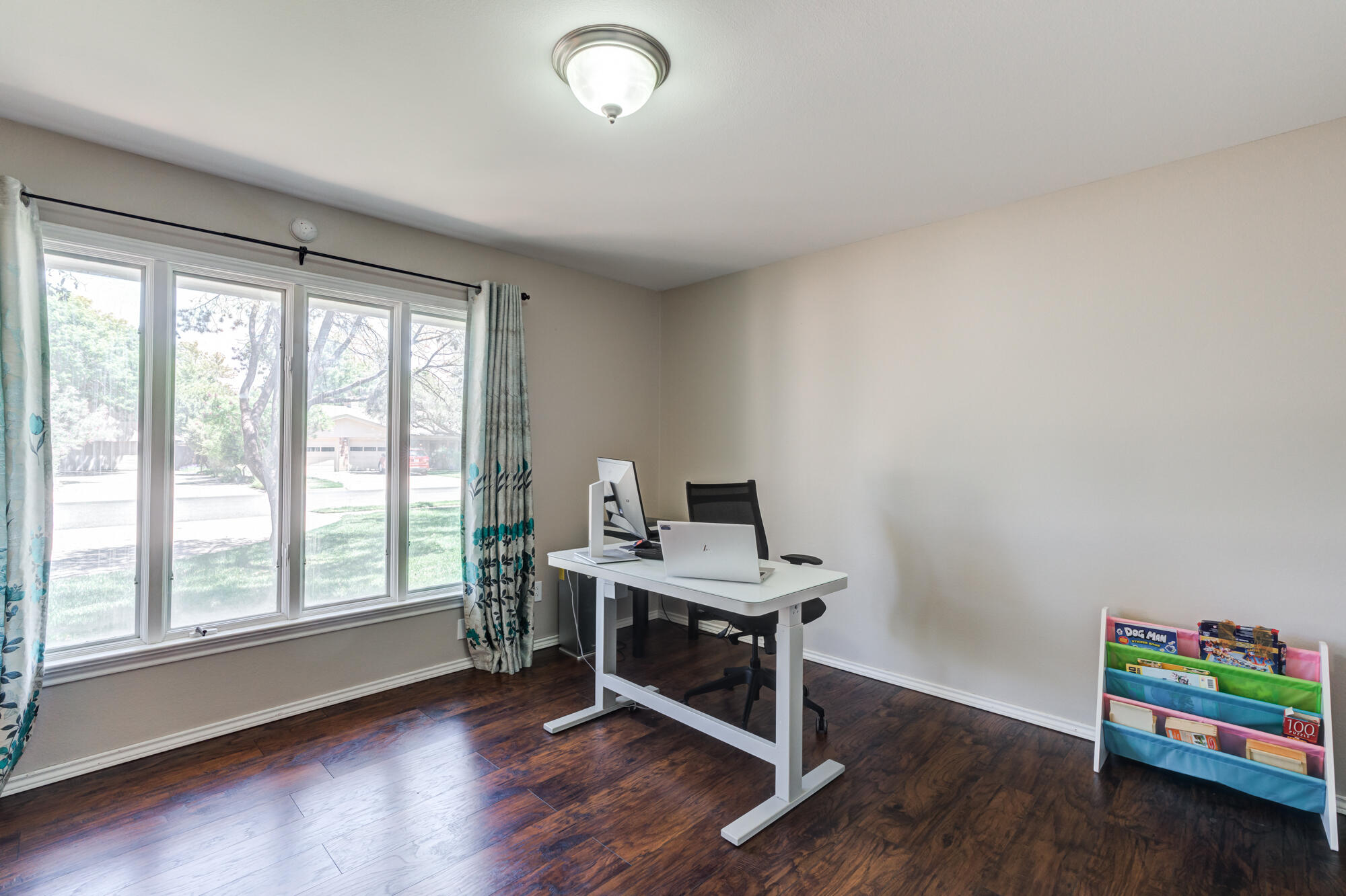 4507 8th Street Lubbock, TX 79416 - Photo 31 of 42 a view of a workspace with furniture and a window