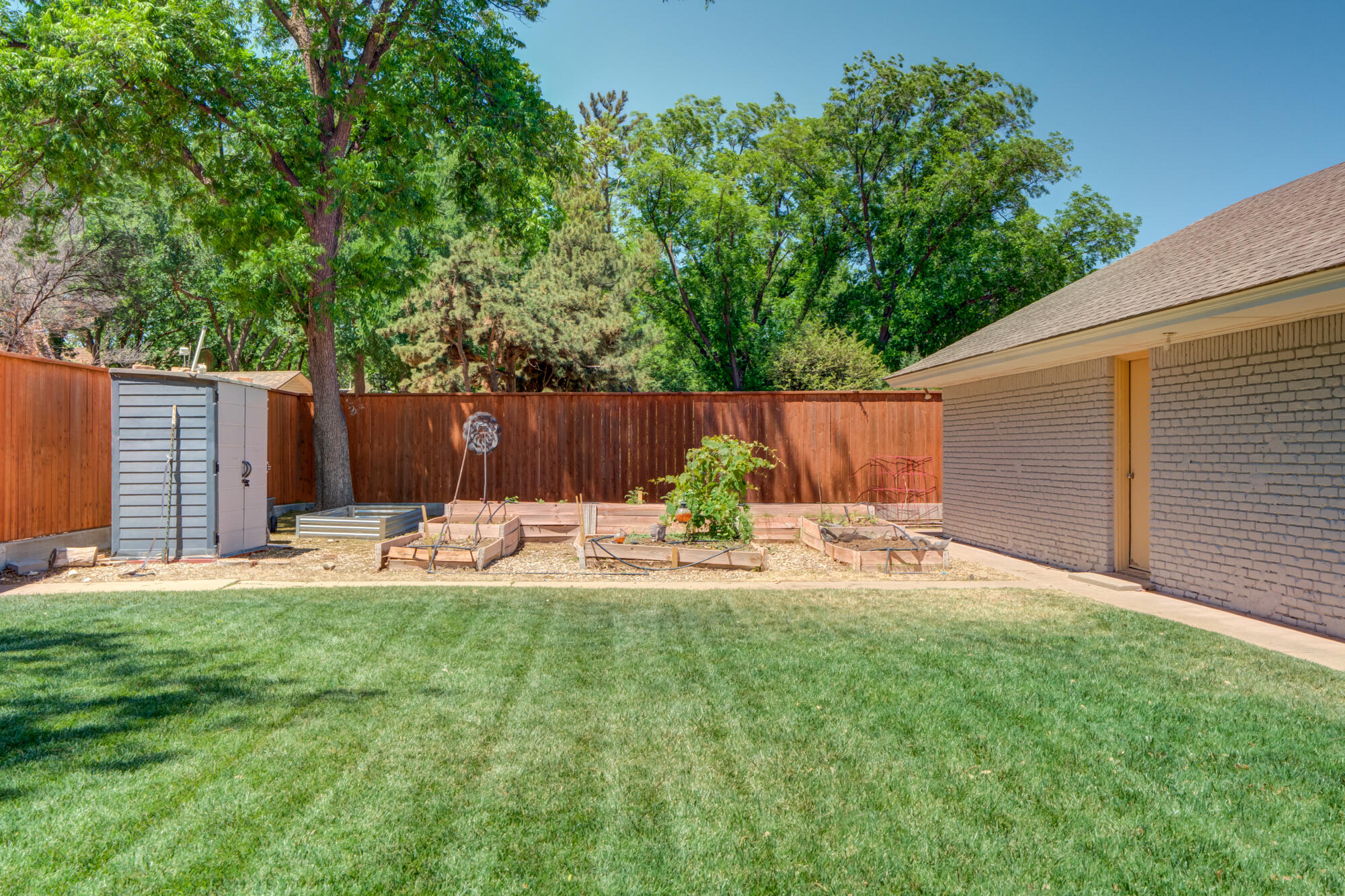 4507 8th Street Lubbock, TX 79416 - Photo 39 of 42 a house view with a sitting space and garden