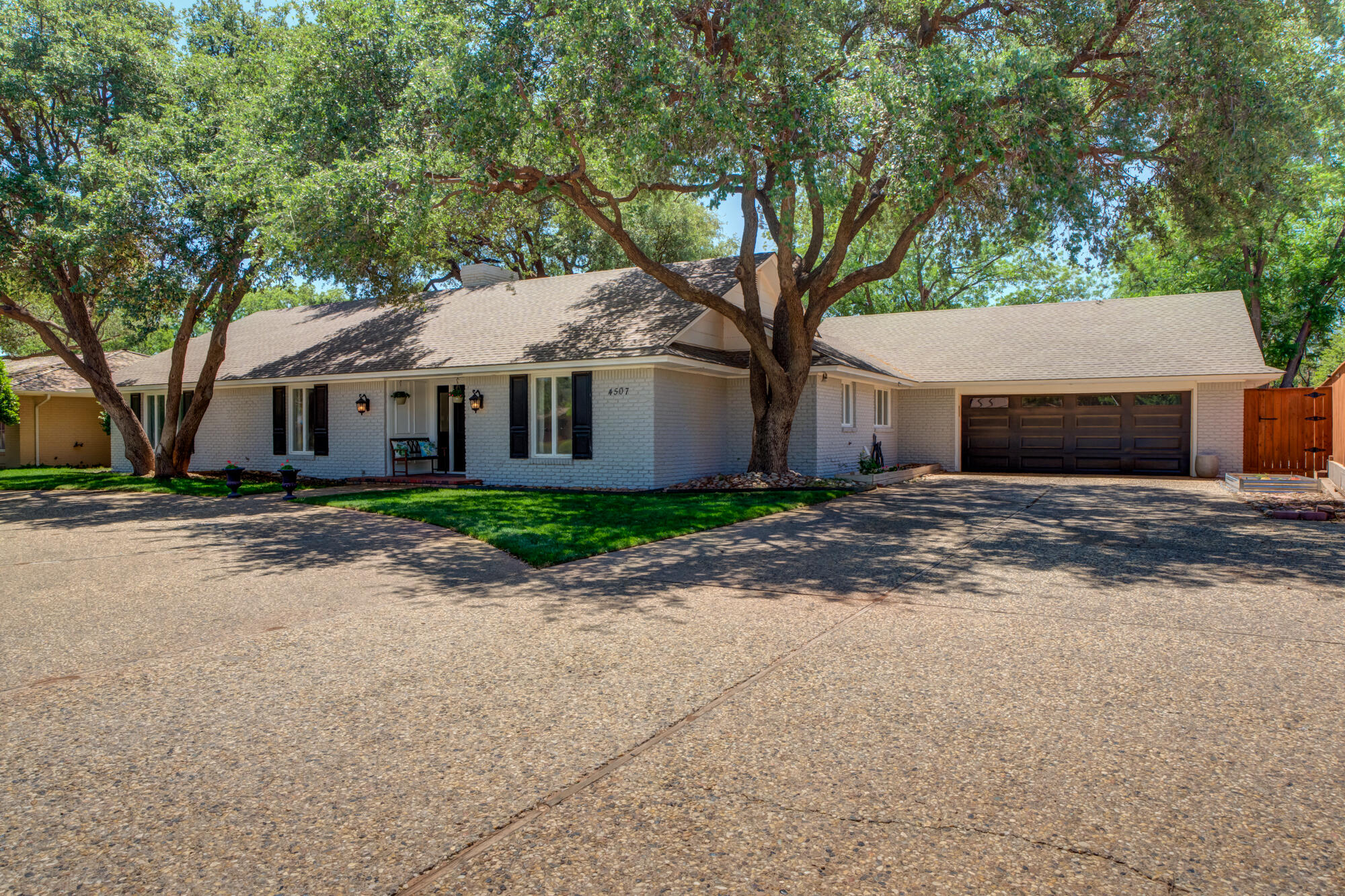 4507 8th Street Lubbock, TX 79416 - Photo 41 of 42 front view of a house with a trees