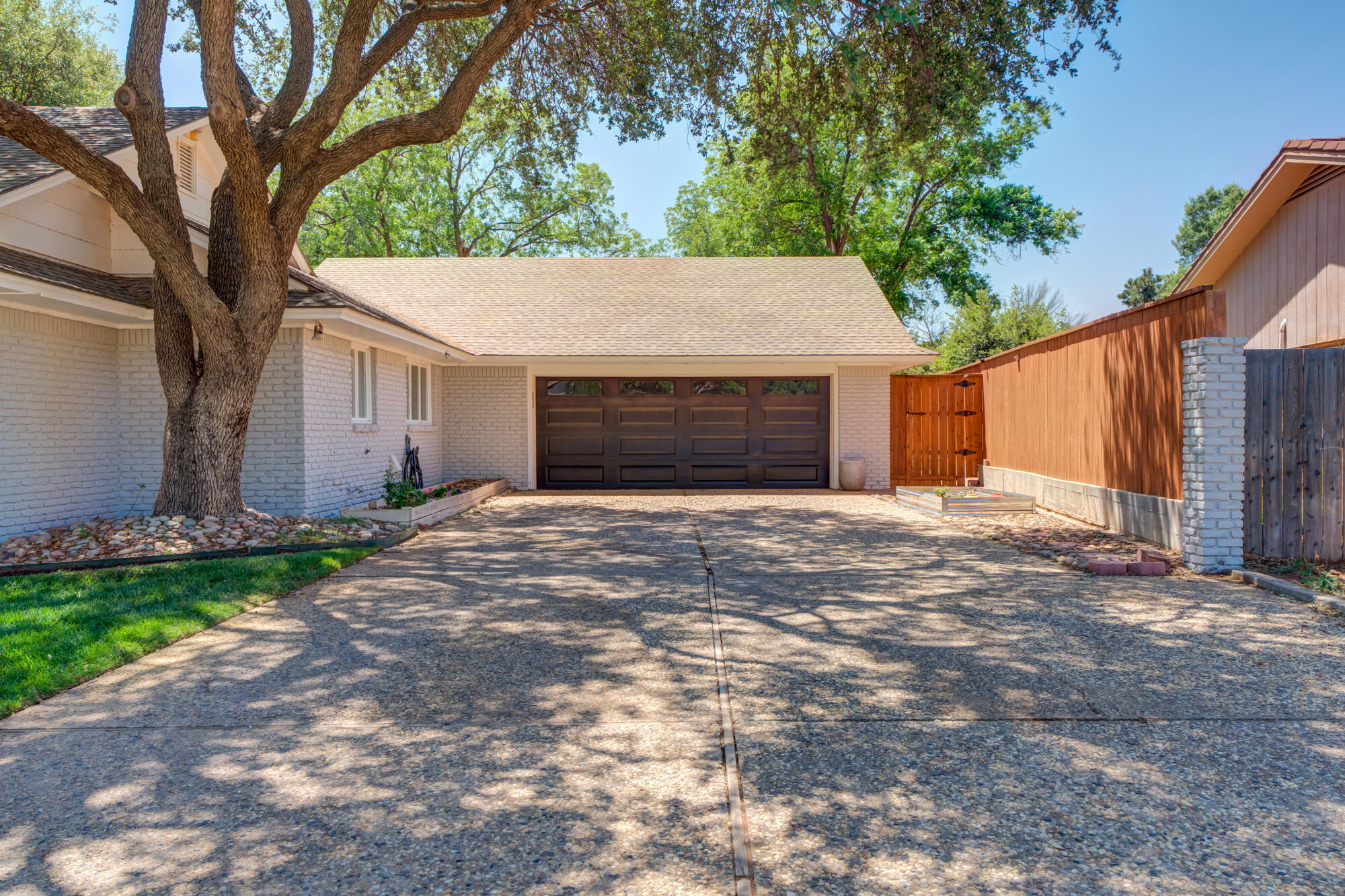 4507 8th Street Lubbock, TX 79416 - Photo 42 of 42 a view of a house with a yard and garage