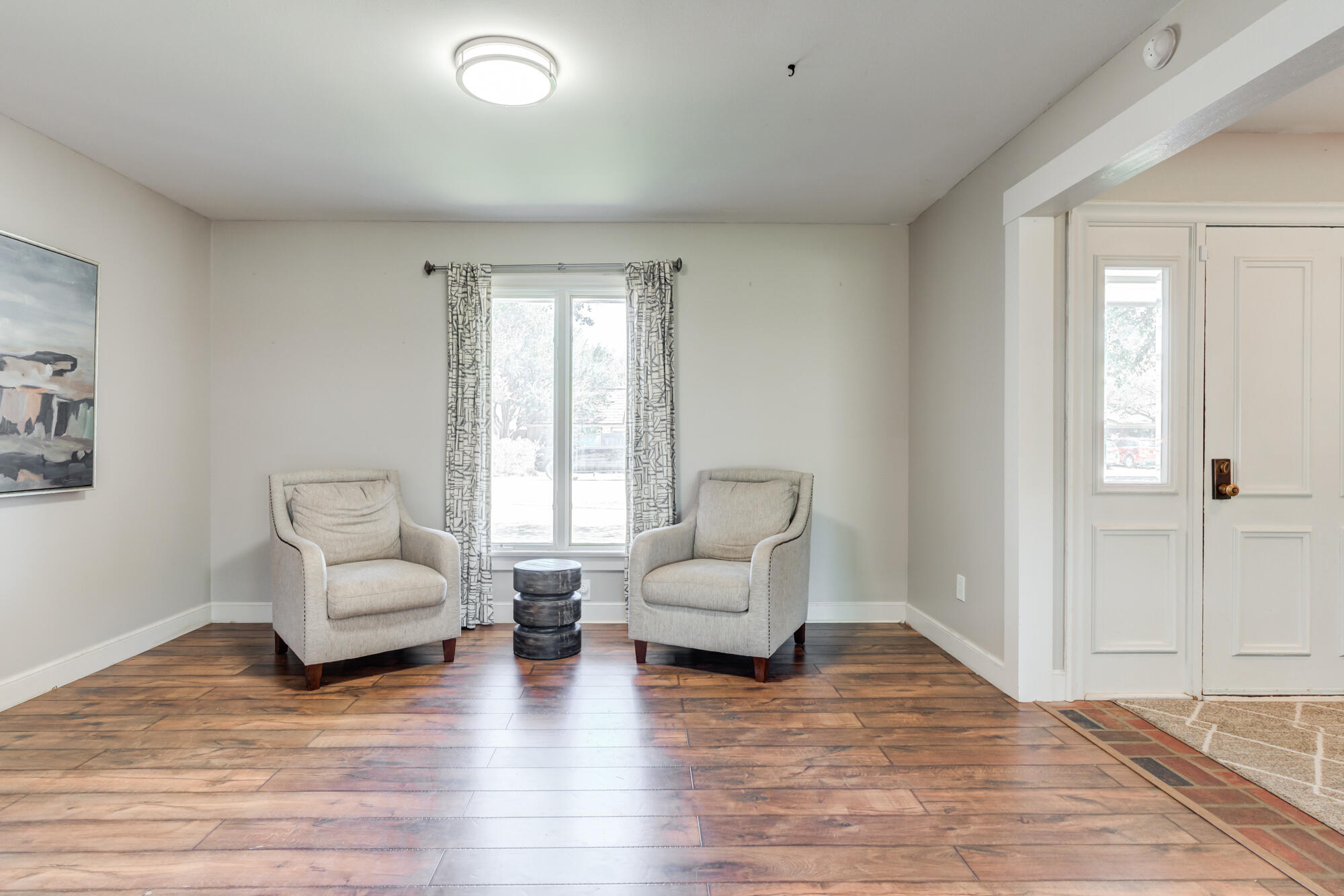 4507 8th Street Lubbock, TX 79416 - Photo 6 of 42 a living room with furniture and a large window