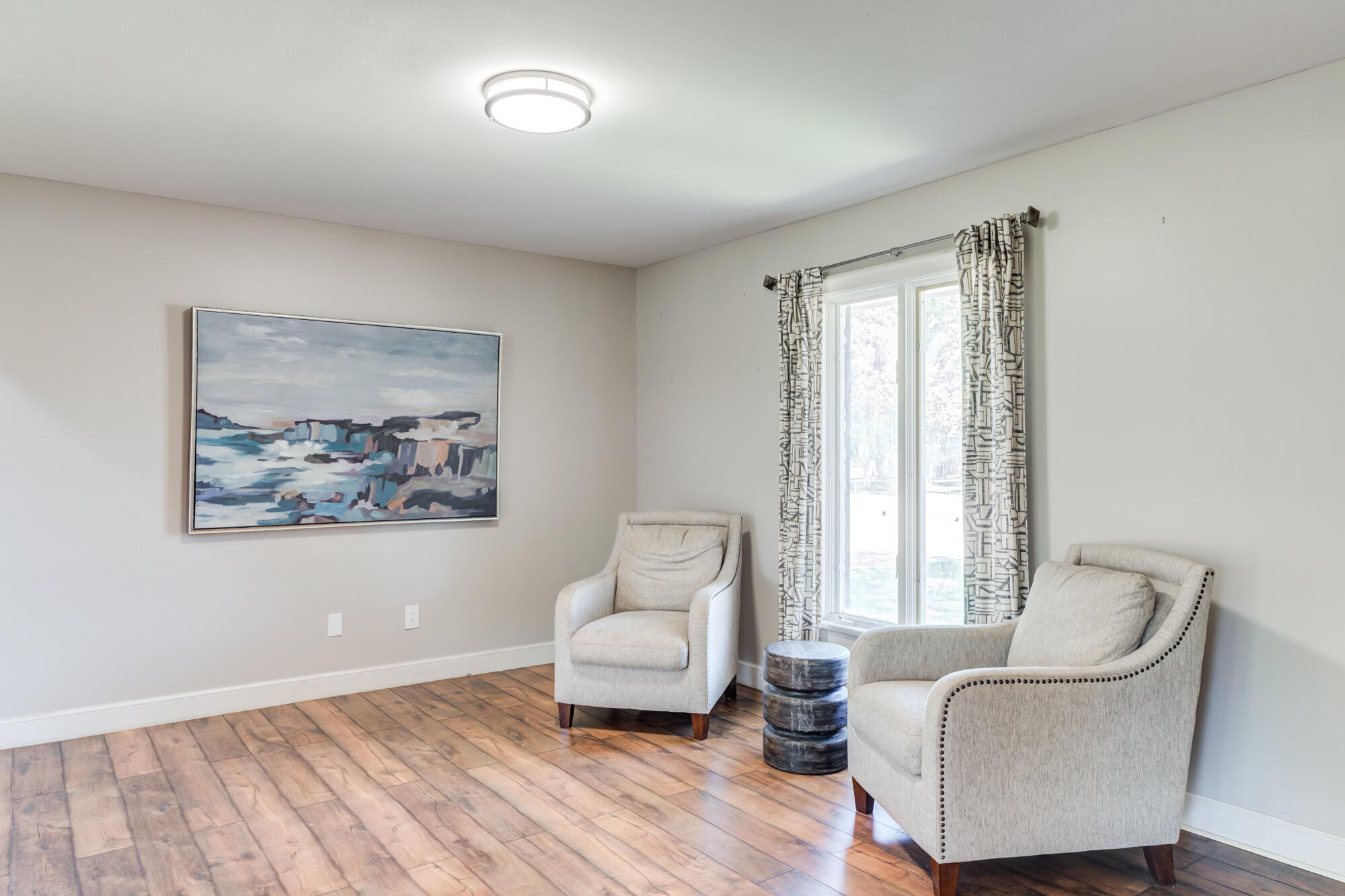 4507 8th Street Lubbock, TX 79416 - Photo 7 of 42 a living room with furniture and a large window