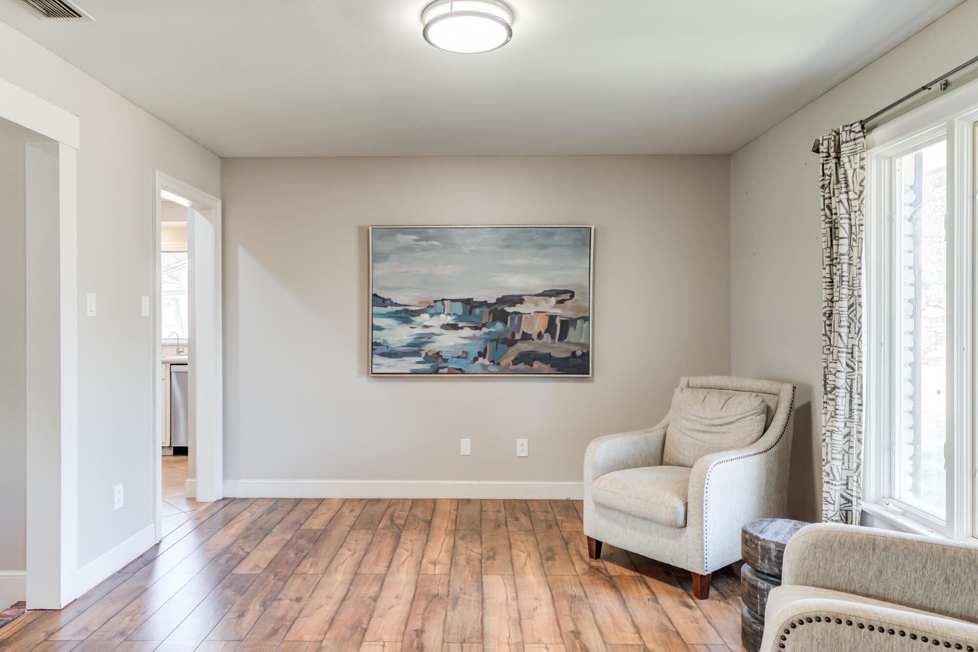 4507 8th Street Lubbock, TX 79416 - Photo 8 of 42 a spacious bedroom with a bed and a couch