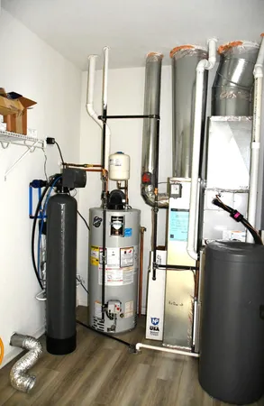 a view of storage and utility room with refrigerator and washer
