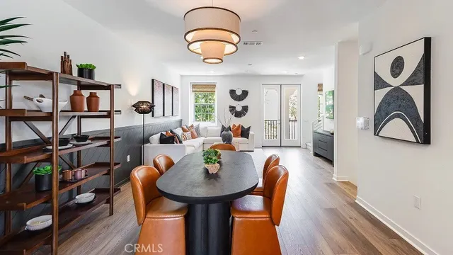 a living room with furniture and a book shelf