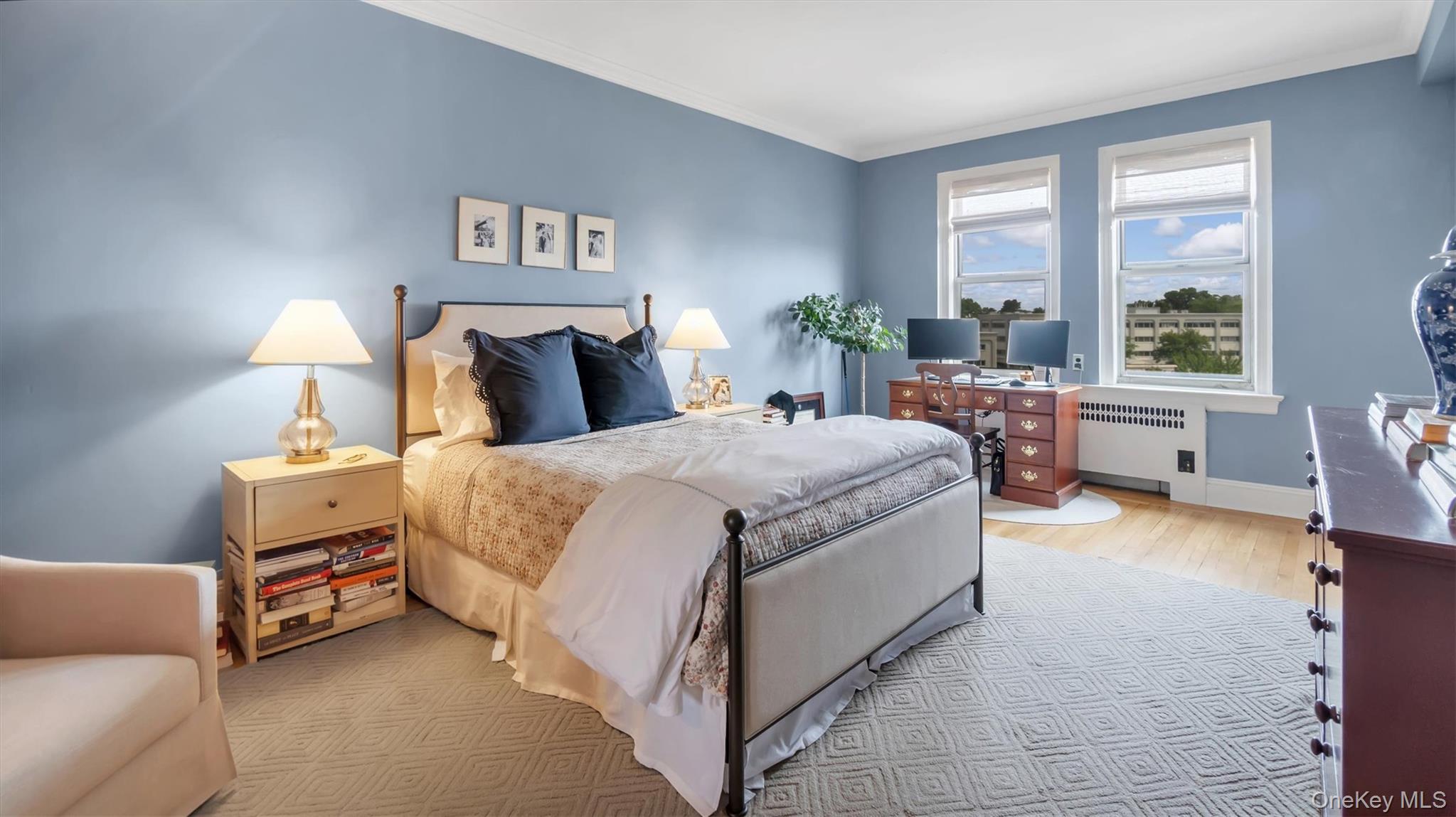 8 Barstow Road, Unit 7H Great Neck, NY 11021 - Photo 12 of 27 a bed room with a bed and a couch