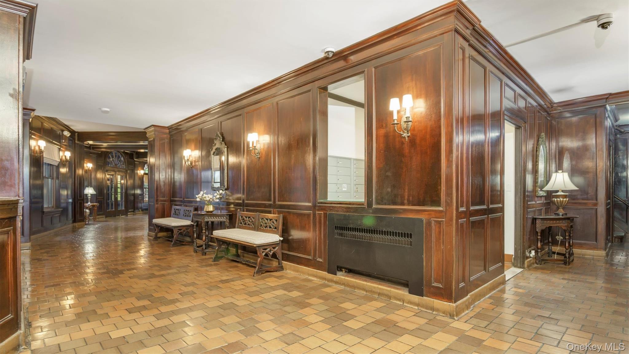8 Barstow Road, Unit 7H Great Neck, NY 11021 - Photo 19 of 27 a lobby with furniture and dining area