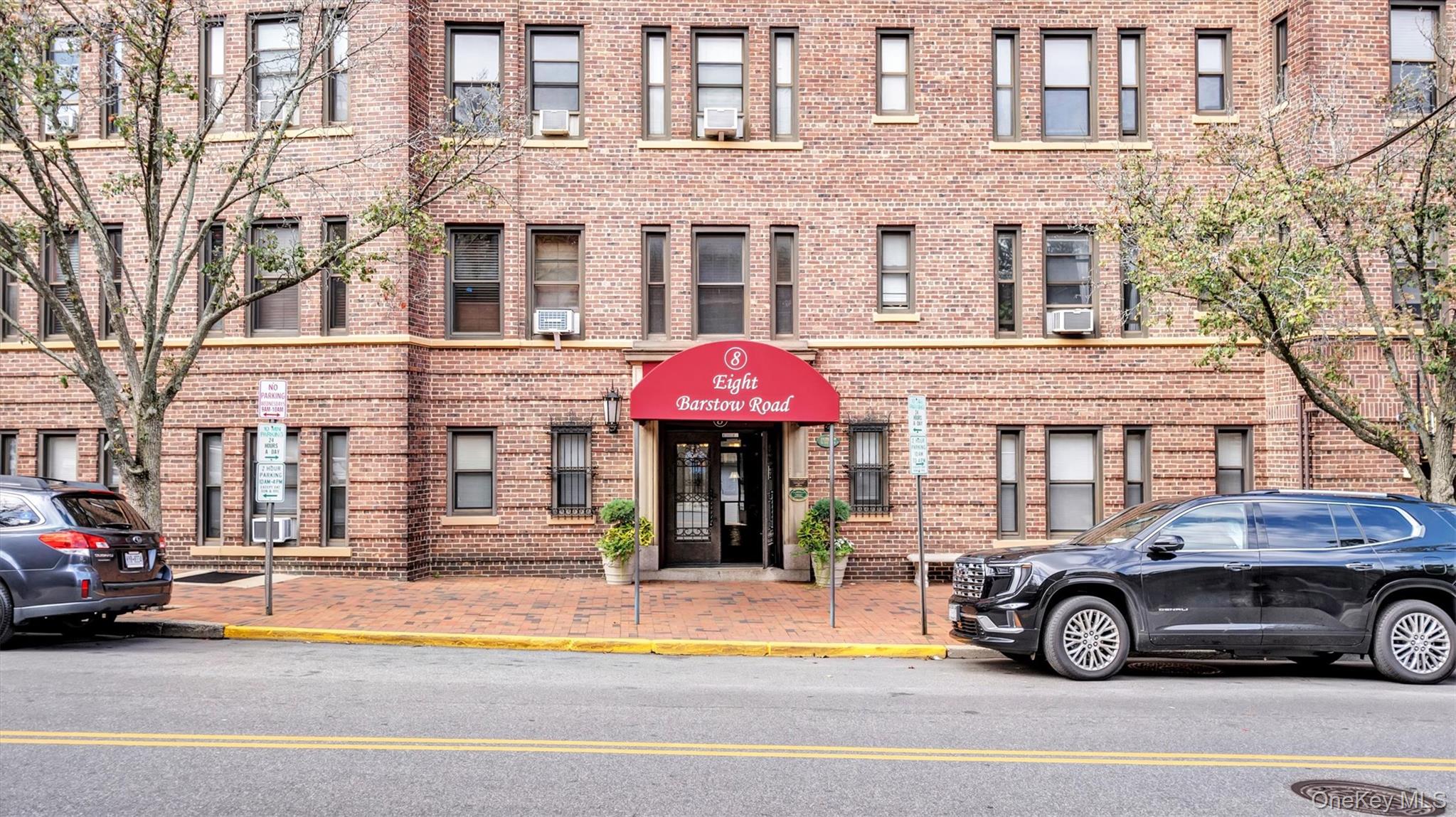 8 Barstow Road, Unit 7H Great Neck, NY 11021 - Photo 4 of 27 a car parked in front of a building