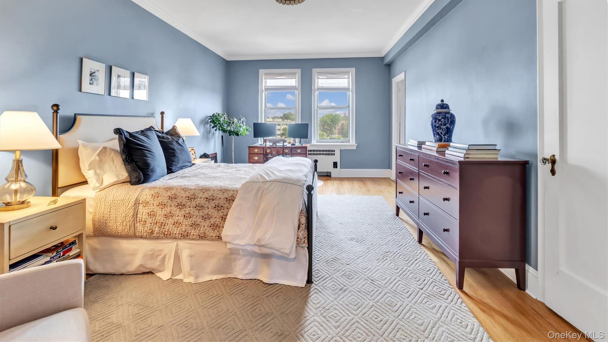 8 Barstow Road, Unit 7H Great Neck, NY 11021 - Photo 10 of 27 a bedroom with bed and window