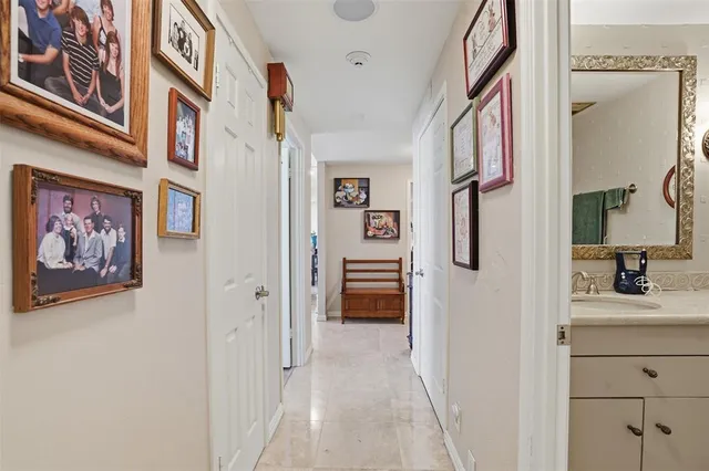 a view of a hallway to rooms