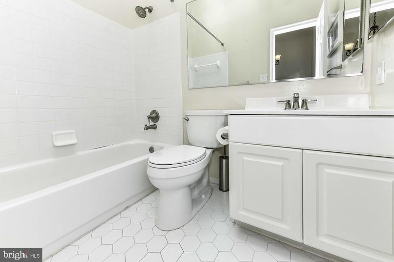 2 Parker Farm Court Silver Spring, MD 20906 - Photo 31 of 34 a bathroom with a sink toilet and bathtub