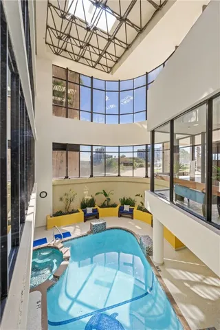 a swimming pool with outdoor seating and yard