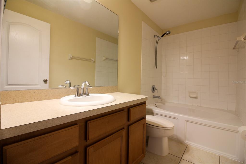 5433 Quarry Rock Road Lakeland, FL 33809 - Photo 16 of 26 a bathroom with a sink a toilet and shower