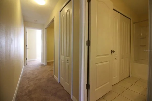 a view of a bathroom with a shower and a sink