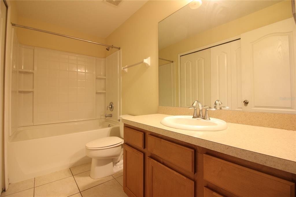 5433 Quarry Rock Road Lakeland, FL 33809 - Photo 18 of 26 a bathroom with a sink a toilet and shower
