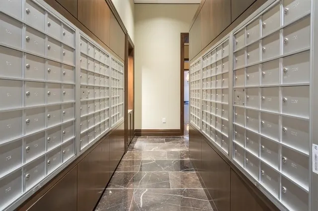 a view of empty room with wooden floor and windows