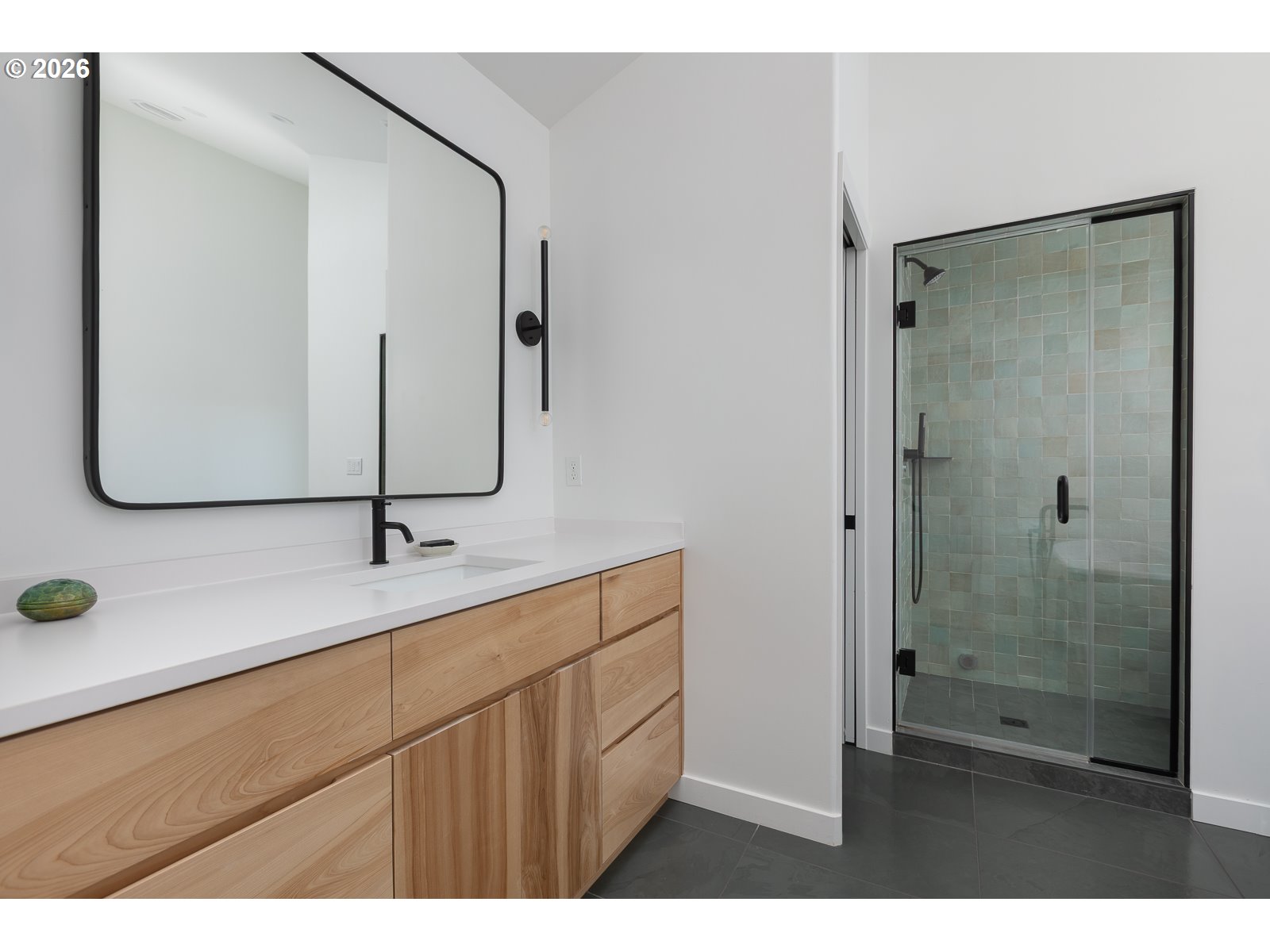 34098 Brooten Road Pacific City, OR 97135 - Photo 17 of 38 a bathroom with a shower sink and mirror