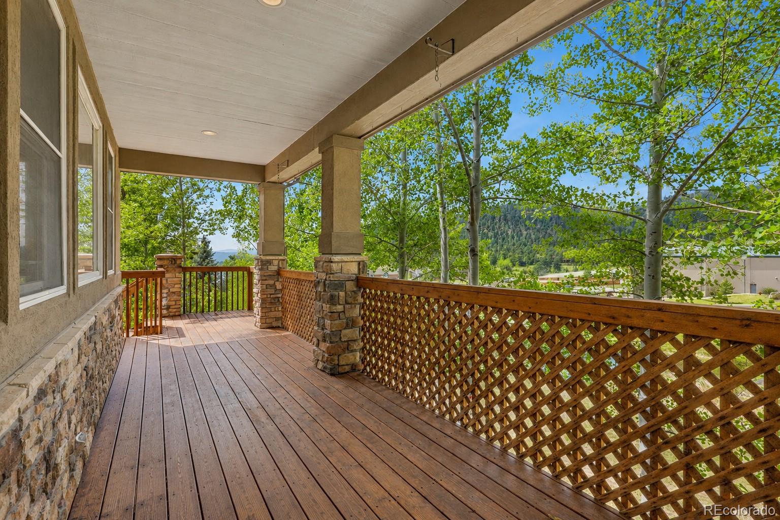 791 Elk Rest Road Evergreen, CO 80439 - Photo 16 of 46 a view of porch with wooden floor