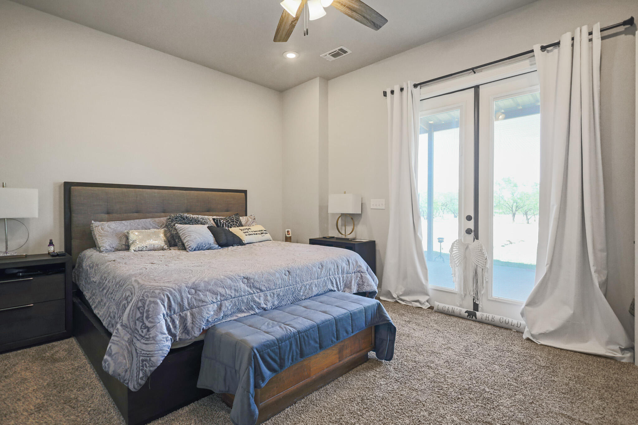 301 Fagan Road Snyder, TX 79549 - Photo 46 of 102 a bedroom with a bed and a large window