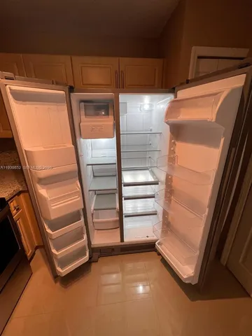a stove top oven sitting inside of a kitchen