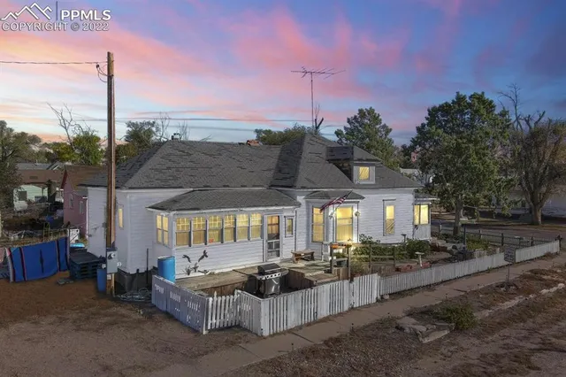 a view of a patio with couches and potted plants