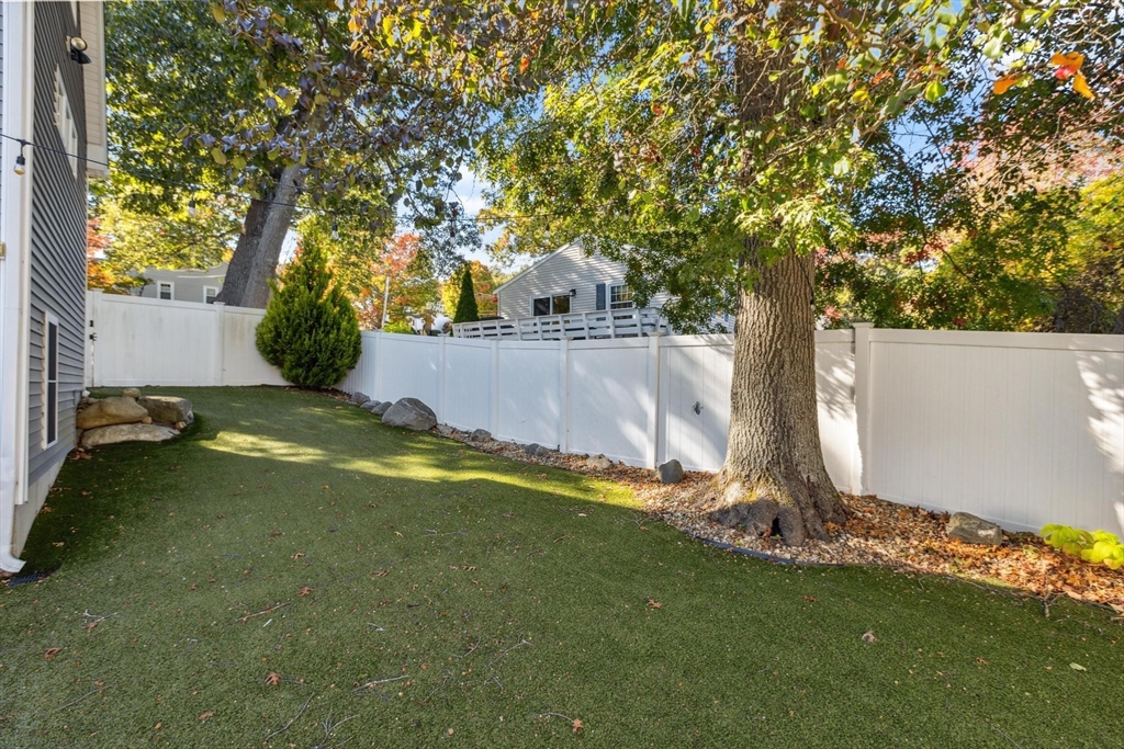 83 County Road Reading, MA 01867 - Photo 11 of 42 a view of a backyard