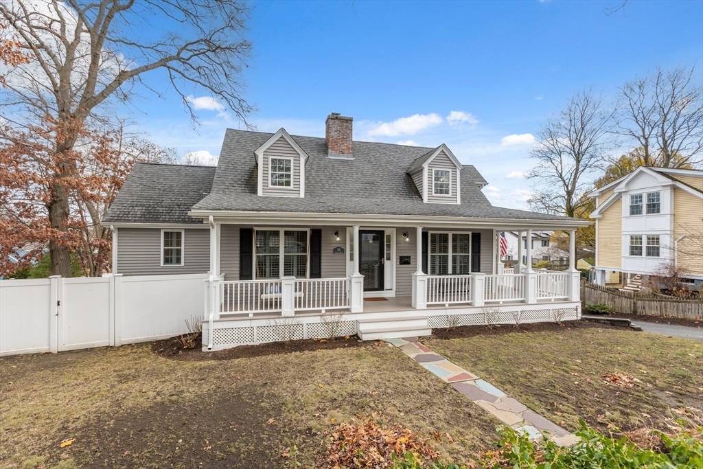 83 County Road Reading, MA 01867 - Photo 13 of 42 a front view of a house with a yard