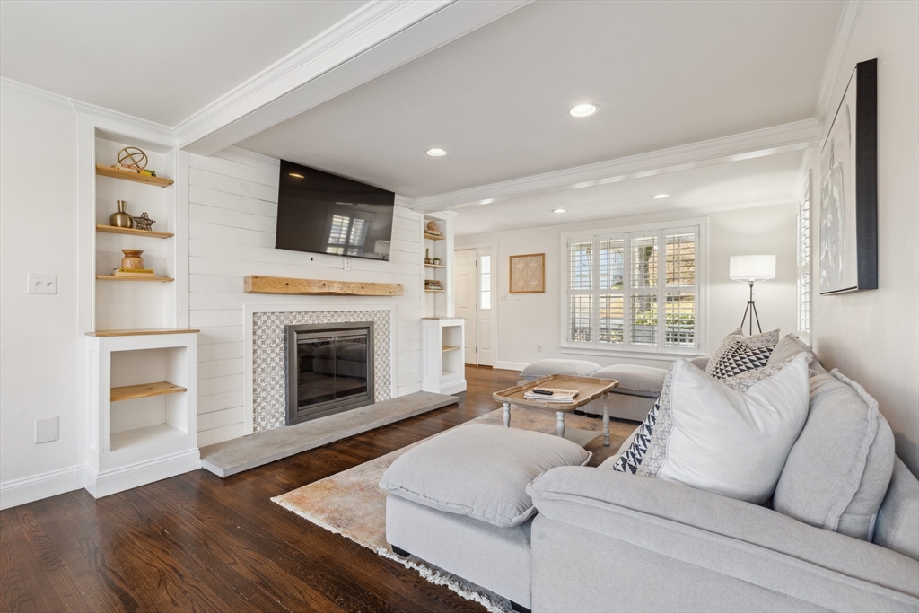 83 County Road Reading, MA 01867 - Photo 22 of 42 a living room with furniture and a fireplace