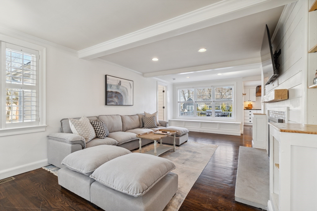 83 County Road Reading, MA 01867 - Photo 23 of 42 a living room with furniture wooden floor and a flat screen tv