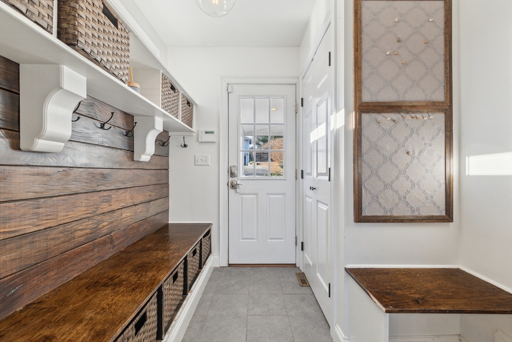83 County Road Reading, MA 01867 - Photo 26 of 42 a view of an entryway with staircase
