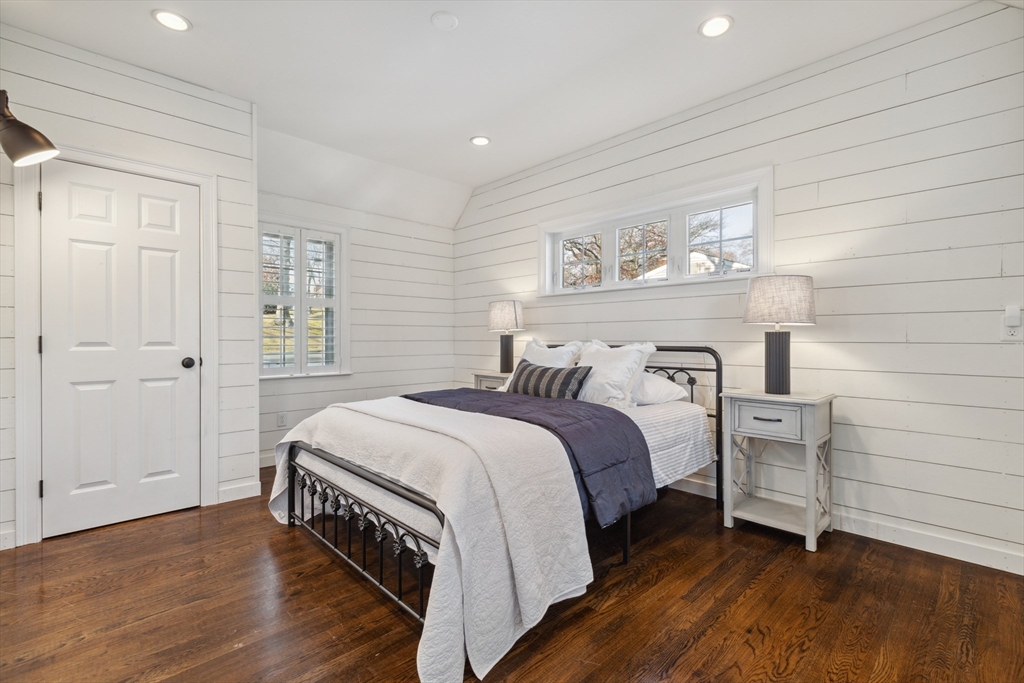 83 County Road Reading, MA 01867 - Photo 27 of 42 a bedroom with a bed and wooden floor