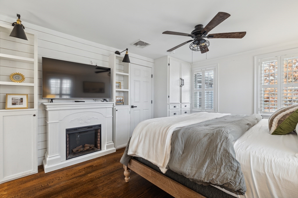83 County Road Reading, MA 01867 - Photo 28 of 42 a spacious bedroom with a bed and a flat screen tv