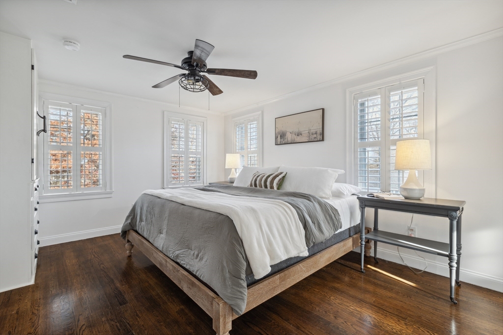 83 County Road Reading, MA 01867 - Photo 29 of 42 a spacious bedroom with a bed and window