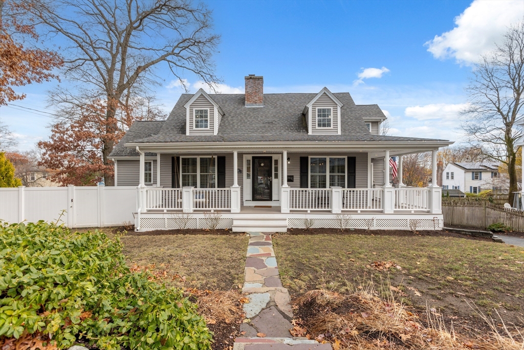 83 County Road Reading, MA 01867 - Photo 3 of 42 a front view of a house with a garden
