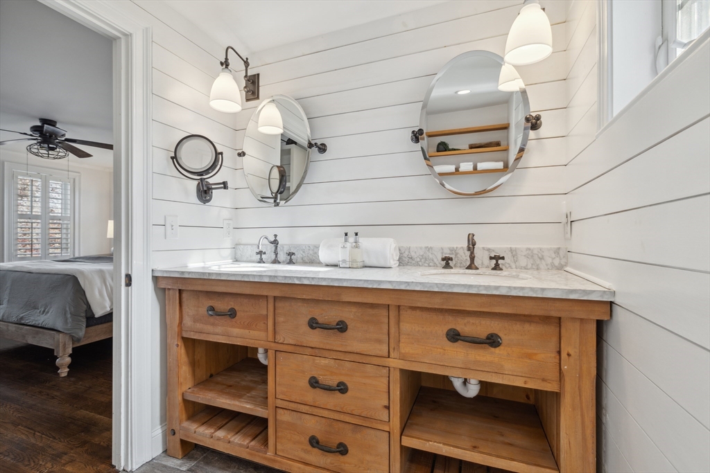 83 County Road Reading, MA 01867 - Photo 31 of 42 a bathroom with a sink and a mirror