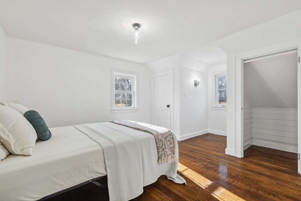 83 County Road Reading, MA 01867 - Photo 35 of 42 a bedroom with a bed and wooden floor