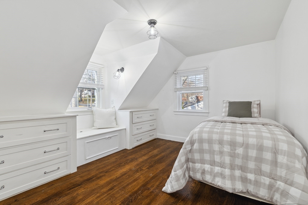 83 County Road Reading, MA 01867 - Photo 36 of 42 a bedroom with a bed and cabinets