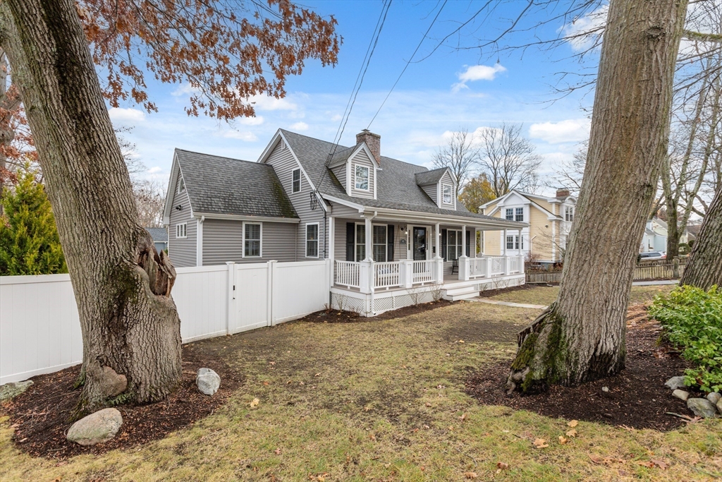 83 County Road Reading, MA 01867 - Photo 42 of 42 a front view of a house with a yard