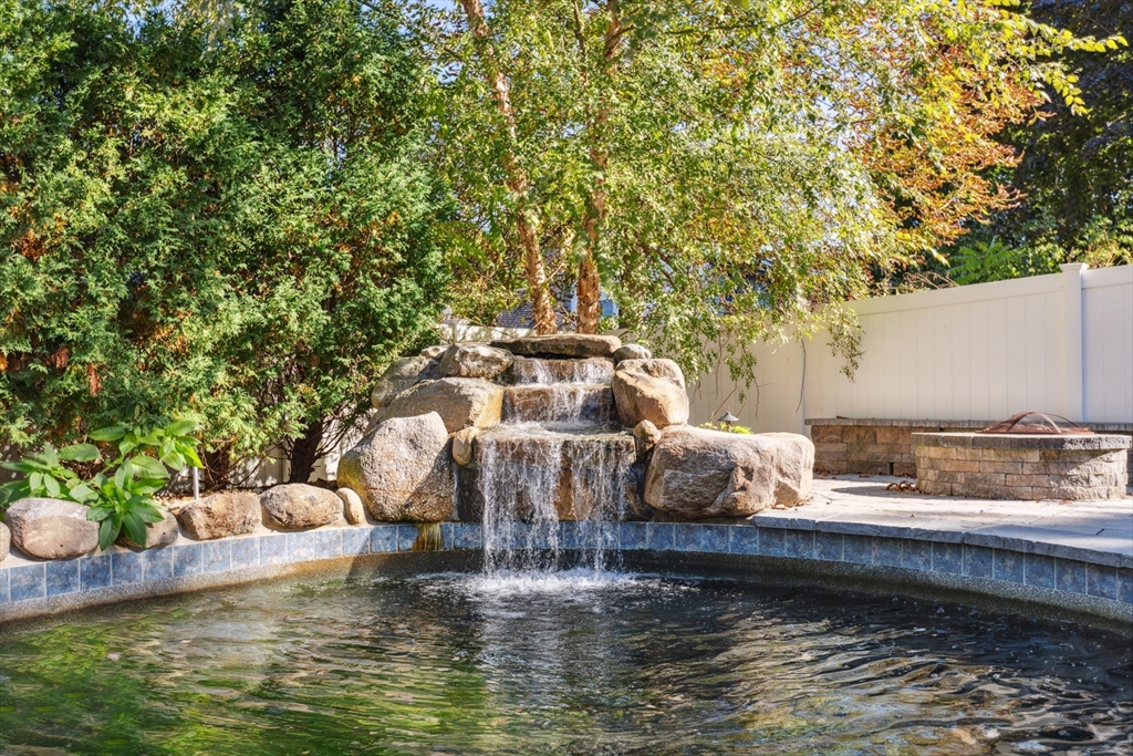 83 County Road Reading, MA 01867 - Photo 5 of 42 a view of a lake with a house