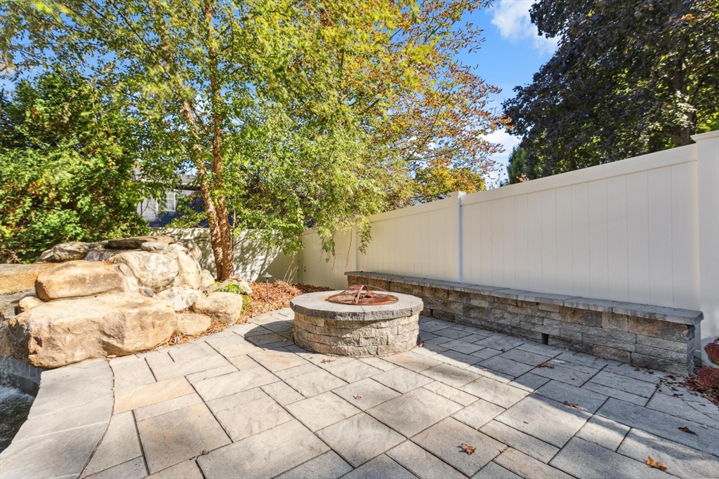 83 County Road Reading, MA 01867 - Photo 9 of 42 a outdoor space with a couch