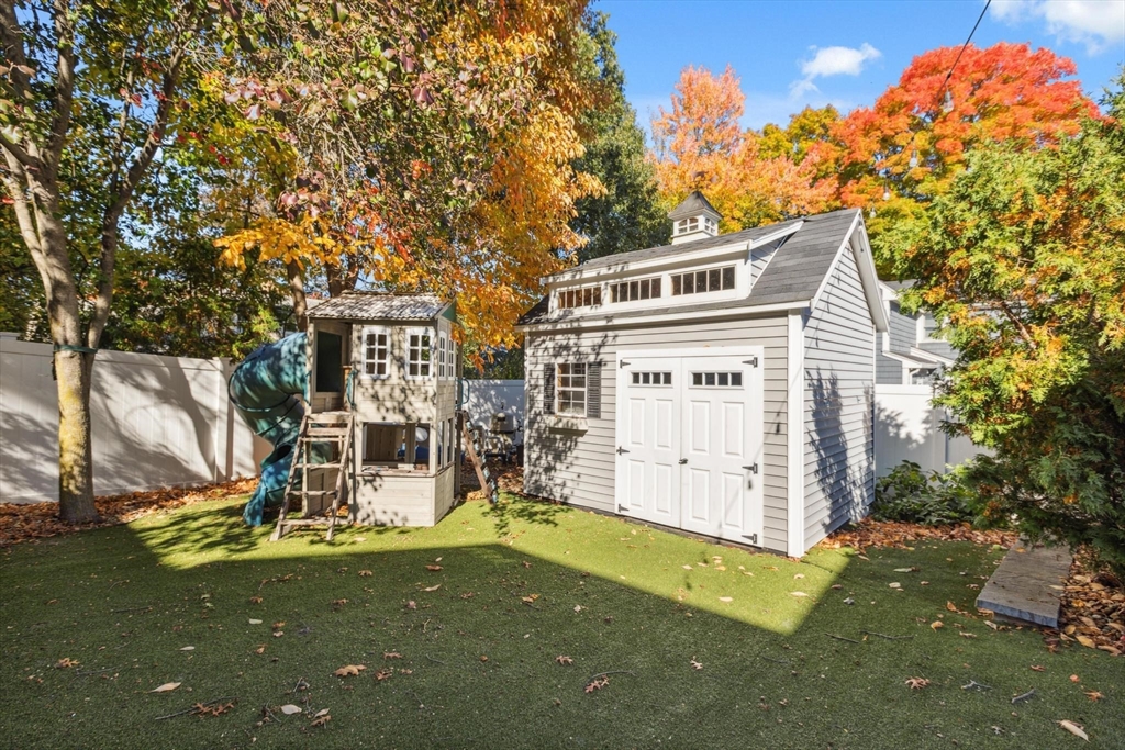 83 County Road Reading, MA 01867 - Photo 10 of 42 a view of a house with a yard
