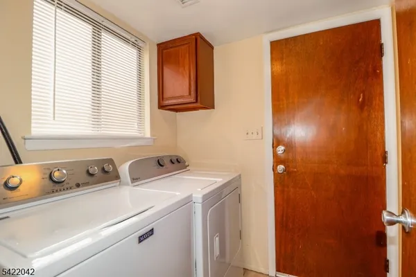 a view of bathroom with a sink and a window