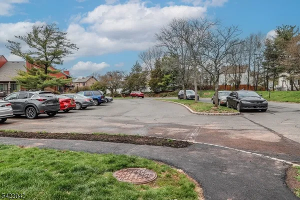 a view of street with parked cars
