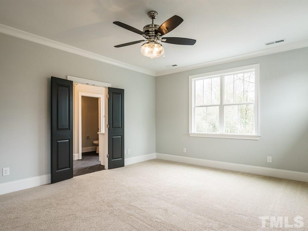 735 Mills Street Raleigh, NC 27608 - Photo 14 of 24 a view of an empty room with a window