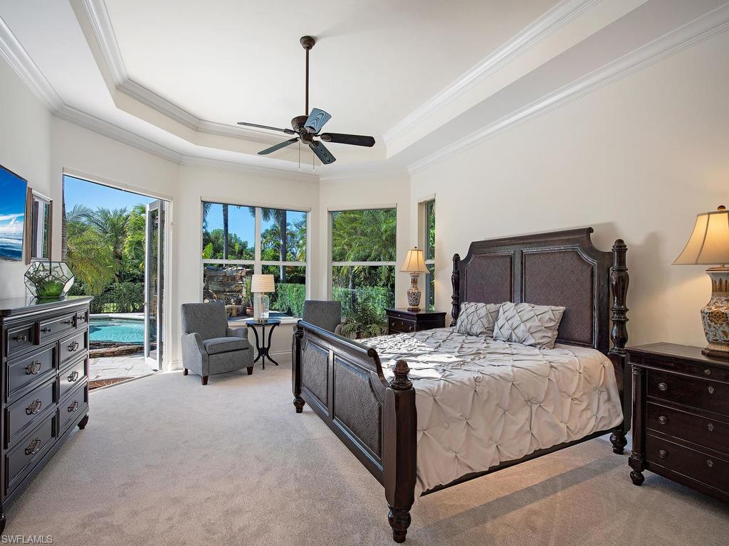7347 Stonegate Drive Naples, FL 34109 - Photo 11 of 20 a bedroom with a bed furniture and a window